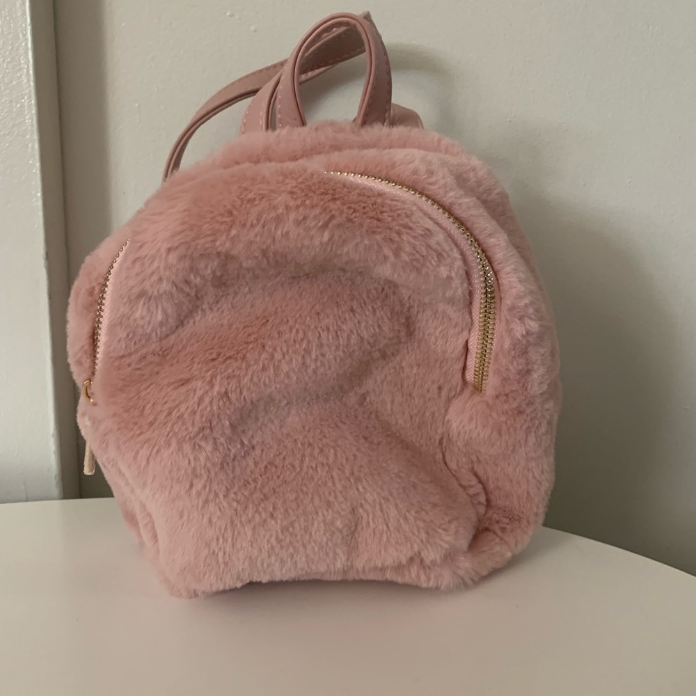 Olivia Milller mini backpack. Light pink. Fuzzy. Adjustable straps.